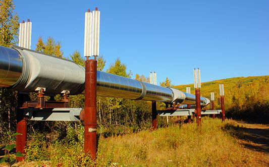 An oil pipeline going through a field