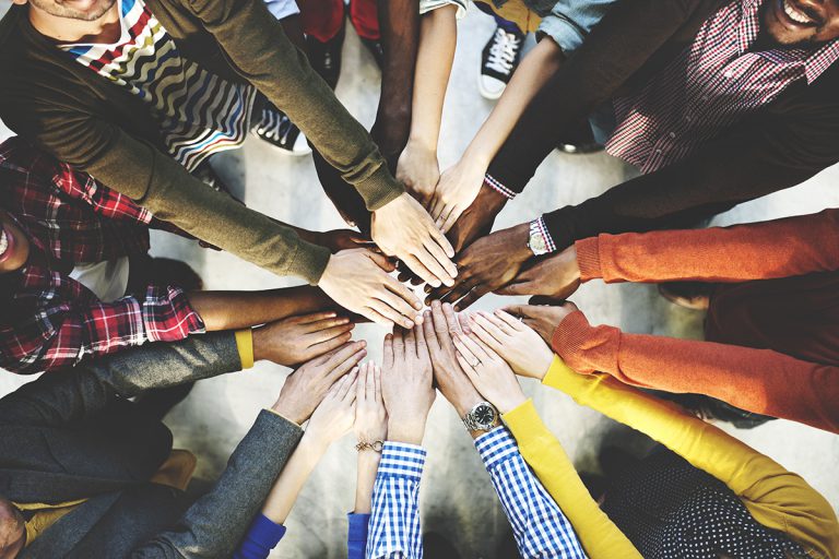 Hands together in teamwork